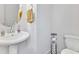 Clean powder room with pedestal sink, stylish fixtures, and ample space at 375 Auburn Valley Way, Auburn, GA 30011