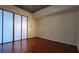 Bedroom featuring hardwood floors and minimalist design with natural light and custom window panels at 620 Glen Iris Ne Dr # 321, Atlanta, GA 30308