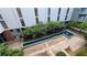 An aerial view of the courtyard featuring a multi-tiered water feature and surrounding lush greenery and architecture at 620 Glen Iris Ne Dr # 321, Atlanta, GA 30308