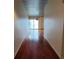 Hallway features wood floors and access to a naturally lit room with a sliding glass door at 620 Glen Iris Ne Dr # 321, Atlanta, GA 30308