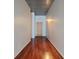 Hallway features wood floors and a door with a metallic ceiling at 620 Glen Iris Ne Dr # 321, Atlanta, GA 30308