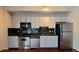 Well-lit kitchen features stainless appliances, dark countertops, and light-colored cabinets at 620 Glen Iris Ne Dr # 321, Atlanta, GA 30308