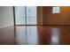 A spacious living room with hardwood flooring and a sliding door to a balcony, offering ample natural light at 620 Glen Iris Ne Dr # 321, Atlanta, GA 30308