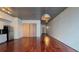 Open-concept living area with wood floors, modern lighting and kitchen with stainless steel appliances at 620 Glen Iris Ne Dr # 321, Atlanta, GA 30308