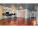Open-concept living area with wood floors, modern lighting and kitchen with stainless steel appliances at 620 Glen Iris Ne Dr # 321, Atlanta, GA 30308