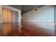 Spacious living room with wood floors, a metallic ceiling, a large window and built-in closets at 620 Glen Iris Ne Dr # 321, Atlanta, GA 30308