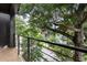Enjoy the outdoors on this balcony with iron railings and beautiful view of the tree-lined street at 92 Rogers Ne St, Atlanta, GA 30317