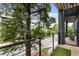 Balcony with artificial turf flooring overlooks the tree lined street at 92 Rogers Ne St, Atlanta, GA 30317