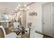 Bright dining room featuring a glass table, modern light fixture, and hardwood floors at 92 Rogers Ne St, Atlanta, GA 30317