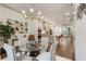 Bright dining room with a glass table, seating for four, and adjacent to the modern kitchen at 92 Rogers Ne St, Atlanta, GA 30317