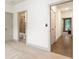 Hallway connecting the rooms of the house and features hardwood flooring and neutral wall colors at 92 Rogers Ne St, Atlanta, GA 30317