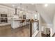 Open-concept kitchen features a large island, stainless steel appliances, and stylish pendant lighting at 92 Rogers Ne St, Atlanta, GA 30317