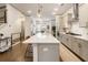 Open concept kitchen boasts a large center island with bar seating and stainless steel appliances at 92 Rogers Ne St, Atlanta, GA 30317