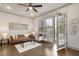 Bright and stylish living room with hardwood floors, modern furniture, and access to balcony at 92 Rogers Ne St, Atlanta, GA 30317