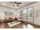 Bright and stylish living room with hardwood floors, modern furniture, and access to balcony at 92 Rogers Ne St, Atlanta, GA 30317