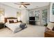 Bright primary bedroom with large windows, ceiling fan, and modern decor at 92 Rogers Ne St, Atlanta, GA 30317