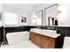 Modern bathroom features double sinks, a soaking tub, and elegant fixtures at 2047 Seavey Dr, Decatur, GA 30032