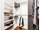 Organized walk-in closet with shelving and hanging space for optimal storage at 2047 Seavey Dr, Decatur, GA 30032