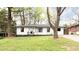 Charming home featuring a well-maintained front lawn and inviting curb appeal at 2047 Seavey Dr, Decatur, GA 30032