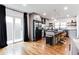 Bright eat-in kitchen with stainless appliances, island with seating, and hardwood floors at 2047 Seavey Dr, Decatur, GA 30032
