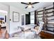 Stylish office featuring a modern desk, hardwood floors, and chic decor at 2047 Seavey Dr, Decatur, GA 30032