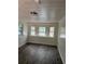 Well-lit bedroom with new wood floors, white walls, and charming decorative window films at 2095 Mulkey Sw Rd, Marietta, GA 30008