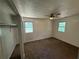 Neutral bedroom with open closet space, carpeting and natural light at 2095 Mulkey Sw Rd, Marietta, GA 30008