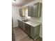 Functional kitchen with gray cabinets, stainless steel appliances, and durable wood floors at 2095 Mulkey Sw Rd, Marietta, GA 30008
