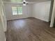 Spacious living area with new wood floors, natural light, and a view of the yard at 2095 Mulkey Sw Rd, Marietta, GA 30008
