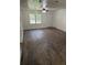 Inviting living area with new wood floors, natural light, and a view of the yard at 2095 Mulkey Sw Rd, Marietta, GA 30008