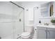 Clean and modern bathroom featuring a glass-enclosed shower, a grey vanity, and neutral finishes at 3831 Flakes Mill Rd, Decatur, GA 30034