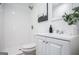 Clean bathroom featuring white tile shower, white vanity and modern decor at 3831 Flakes Mill Rd, Decatur, GA 30034