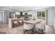 Stylish eat-in kitchen featuring an island with stool seating, stainless steel appliances, and a sliding glass door at 3831 Flakes Mill Rd, Decatur, GA 30034