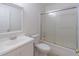 Well-lit bathroom with a shower/tub combo and frosted glass doors, alongside vanity sink at 4307 Windward Ln, Norcross, GA 30093
