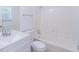 A clean bathroom with white vanity, toilet, and shower/tub combo, offering a refreshing space at 4307 Windward Ln, Norcross, GA 30093