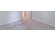 This bedroom features neutral walls, carpet, an entry door, and one outlet at 4307 Windward Ln, Norcross, GA 30093