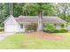 Charming single-story home featuring a well-manicured lawn and attached one car garage at 4307 Windward Ln, Norcross, GA 30093