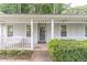 Inviting covered porch with a porch swing, offering a relaxing spot to enjoy the outdoors at 4307 Windward Ln, Norcross, GA 30093
