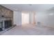 Spacious living room with stone fireplace and neutral carpeting, ideal for entertaining at 4307 Windward Ln, Norcross, GA 30093
