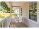 Relaxing front porch with a classic white porch swing, perfect for enjoying the outdoors at 4307 Windward Ln, Norcross, GA 30093