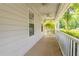 Inviting covered porch with ceiling fans and white railings, perfect for relaxing outdoors at 4307 Windward Ln, Norcross, GA 30093