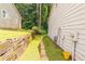 Side yard with retaining wall, walkway and lush greenery at 4307 Windward Ln, Norcross, GA 30093