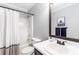 Bathroom featuring a vanity, mirror, toilet, shower-tub combo and neutral color scheme at 7108 Hummingbird Ln, Winston, GA 30187