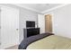 Bedroom featuring a dark dresser, comfortable bed, with easy access to closet at 7108 Hummingbird Ln, Winston, GA 30187