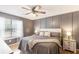 Spacious bedroom with a ceiling fan, hardwood floors, and large window at 7108 Hummingbird Ln, Winston, GA 30187