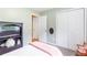 Comfortable bedroom featuring cozy rocking chair, and closet, providing ample storage at 7108 Hummingbird Ln, Winston, GA 30187
