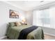 Bedroom with a comfortable bed, a window with light-filtering shades, and neutral walls at 7108 Hummingbird Ln, Winston, GA 30187