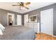 Bedroom featuring ceiling fan, wood floors, closet, and a window at 7108 Hummingbird Ln, Winston, GA 30187