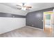 This bedroom features gray walls, carpet floors, and access to other rooms in the house at 7108 Hummingbird Ln, Winston, GA 30187