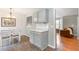 Open concept design in the kitchen and dining room with a view to the living room at 7108 Hummingbird Ln, Winston, GA 30187